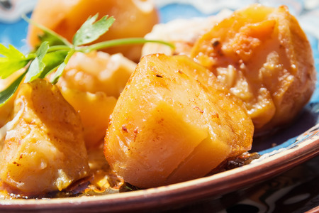 Baked gratin potatoes with parsley and vegetablesの写真素材