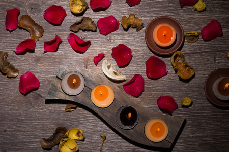 Fresh Rose Petals, Potpourri And Candles on Wooden Backgroundの写真素材