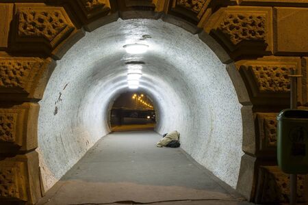 Tunnel and homeless at night in Budapestの写真素材