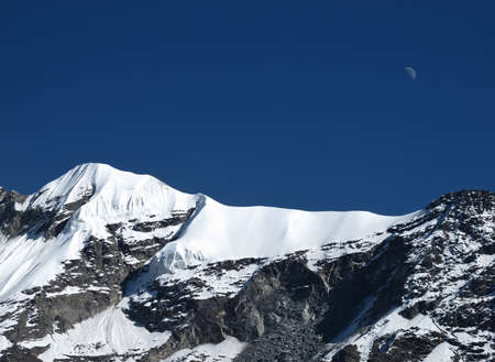 Moon Over A High Mountain In The Annapurna Conservation Areaの写真素材