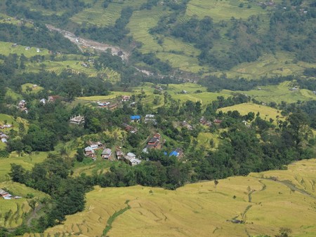 Village and rice fields near Khudi, Central Nepalの写真素材