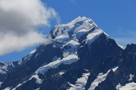 Glacier on top of Mt Cook and cloud. Highest mountain of the Southern Alps.