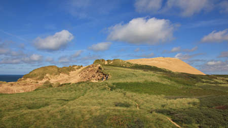 Summer day at the west coast of Denmark. Rubjerg Knude, 90 meter high sand dune.の写真素材