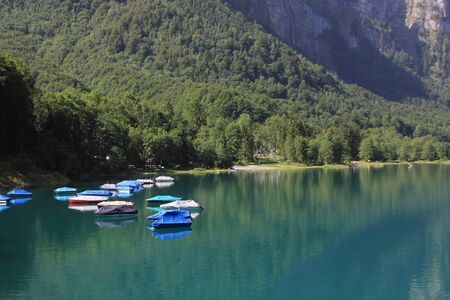 Fishing boats on the shore of Lake Kloental.の写真素材