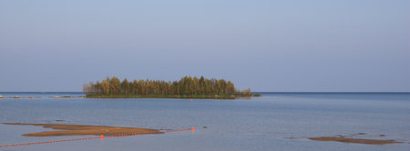 Small island covered by trees, Lake Vanern, Sweden.の写真素材
