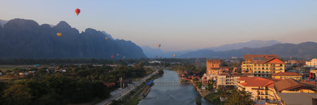Many hot air balloons over the Nam Song River, Vang Vieng, Laos.の写真素材