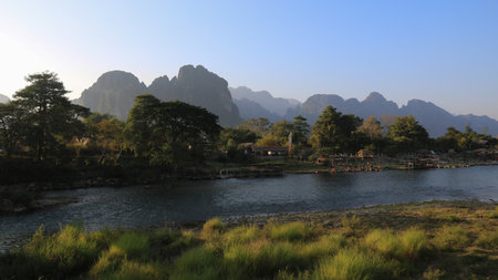 Nam Song River and mountain ranges surrounding Vang Vieng, Laos.の写真素材