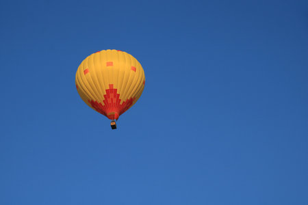 Yellow orange hot air balloon over Vang Vieng, Laos.の写真素材
