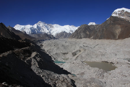 Ngozumba Glacier and Cho Oyu, high mountain seen from Gokyo, Nepal.の写真素材
