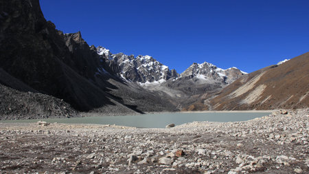 Blue sky over Thonak Tsho, lake in the upper Gokyo Valley, Nepal.の写真素材