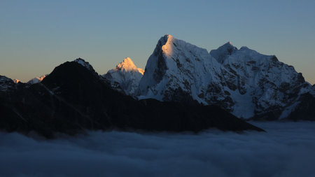 Sun lit peaks of Ama Dablam and Cholatse at sunset, Nepal.の写真素材