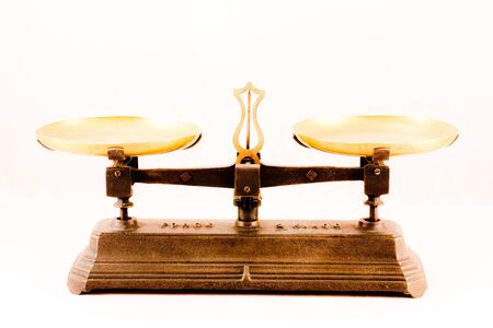 An antique scale on white background, useful for conceptualの写真素材