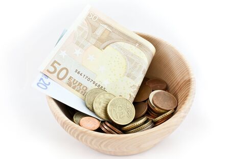 Wood cup full of savings in Euro, good for conceptsの写真素材