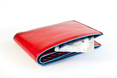 Condom in a red wallet: concepts of prevention and contraceptionの写真素材