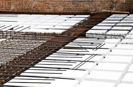 Technical detail of building operations: floor. Materials: polystyrene, steel bars, concrete