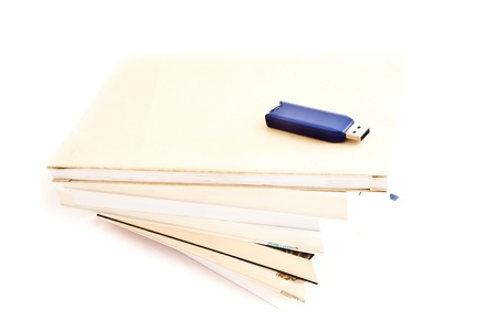 Concept of memories: blue usb key close to booksの写真素材