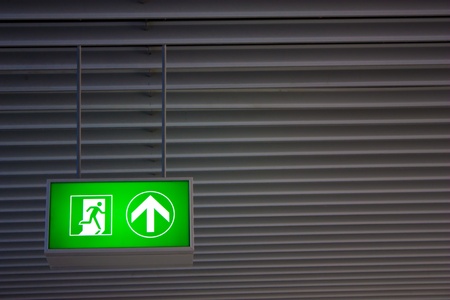 Emergency exit sign in modern offices inside an industrial plantのeditorial素材