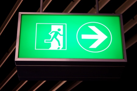 Emergency exit sign in modern offices inside an industrial plantのeditorial素材