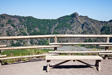 Empty bench in front of volcano Vesuvius crater. This bench is used during trekking