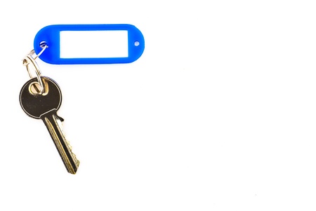Key with a blank tag, isolate on white background. Add your text on the tag.の写真素材