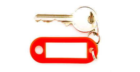 Key with a blank tag, isolate on white background. Add your text on the tag.