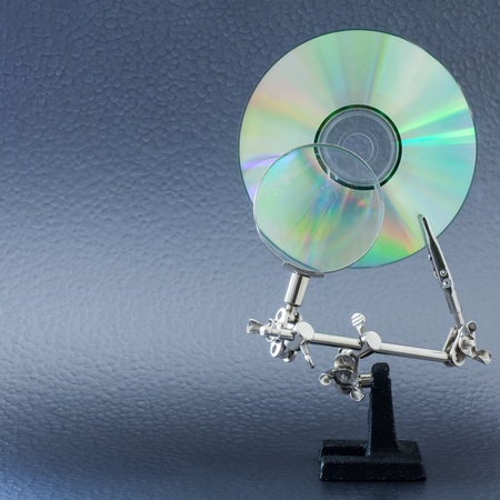 Concept for data analysis, CD and lens on a vivid colors backgroundの写真素材