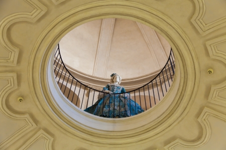 Mannequin dressed in old fashion (18th century). Interior of an old Italian palace.の写真素材