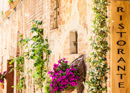 Tuscany, Italy. Sightseeing of Italian Restaurant in traditional small village in Val Orciaの写真素材