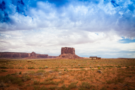 Complementary colours blue and orange in this iconic view of Monument Valley, USAの写真素材