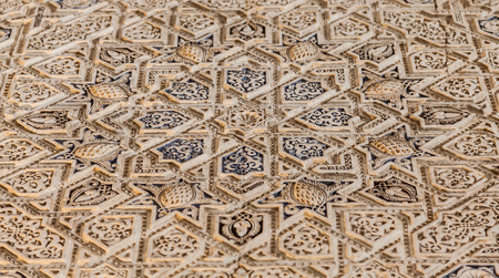 Alhambra in Granada, Spain. Detail of a 800 years old wall in islamic style.の写真素材