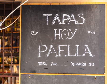 Walking in Barcelona - Spain - you can find this common menu purpose showed outside bars and restaurants.のeditorial素材