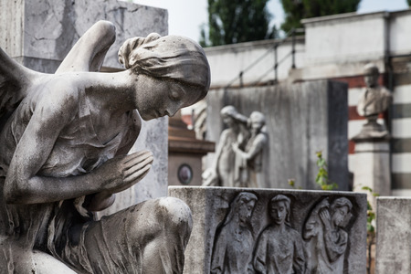 More than 100 years old statue. Cemetery located in North Italy.の写真素材