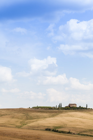 Tuscany, Val d'Orcia area. Wonderful countryside in a sunny day, just before rain arrivalの写真素材