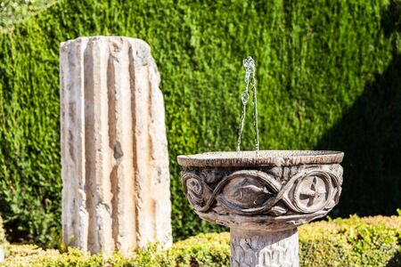 Roman ruins used as garden furniture in Italyの写真素材