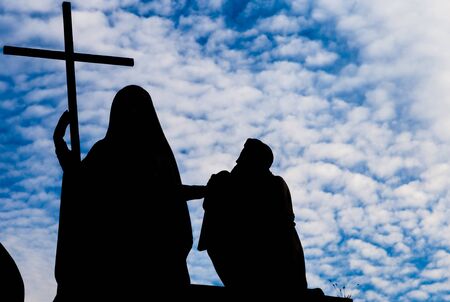 Religion Statue with cross - located in front of Gran Madre Church, Turinの写真素材