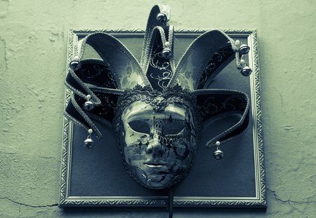 Traditional Venetian Mask on old wall backgroundの写真素材