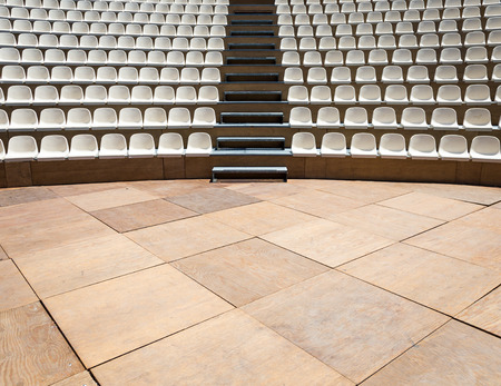 Open air theater with natural daylight; plastic seat rows