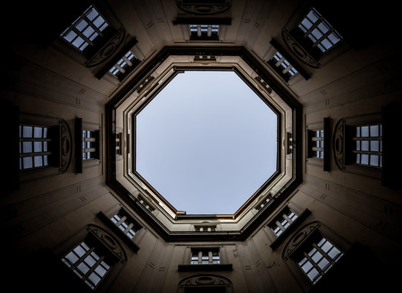 Italy, Milan. Interior of an old palace, looking to the sky with a wide 16mm lens.の写真素材
