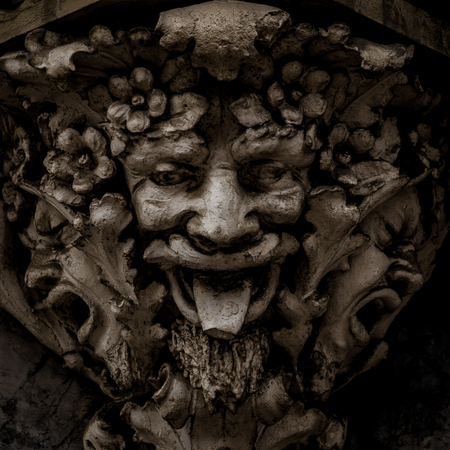 Italy, Turin. This city is famous to be a corner of two global magical triangles. This is a protective mask of stone on the top of a luxury palace entrance, dated around 1800のeditorial素材