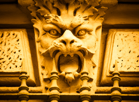 Italy, Turin. This city is famous to be a corner of two global magical triangles. This is a protective mask of stone on the top of a luxury palace entrance, dated around 1800のeditorial素材