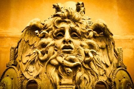 Italy, Turin. This city is famous to be a corner of two global magical triangles. This is a Medusa's head made of bronze close to the historical garden of Valentino in Turin.の写真素材