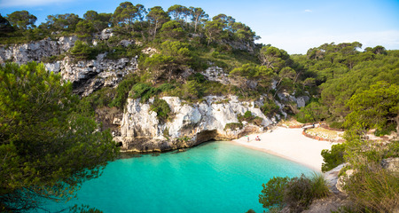 MENORCA, SPAIN - June 29, 2018: The most beautiful beach in Menorca during first hours of the day...