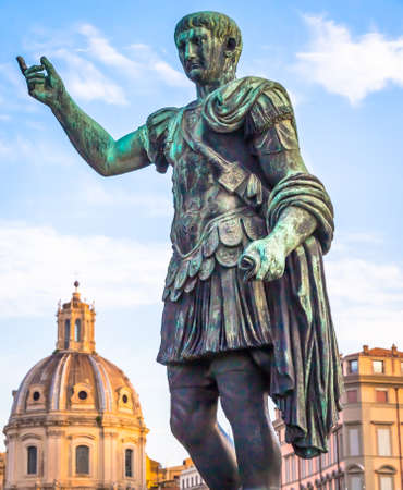 ITALY, ROME - CIRCA AUGUST 2020: Statue of Caesar Emperor, made of bronze. Natural sunrise light. Ancient  role model of Leadeship and Authority .のeditorial素材