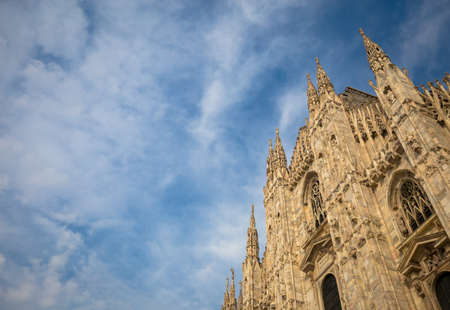 Milan Cathedral (Duomo di Milano) with copy space for text. Blue sky background and sunset light.のeditorial素材