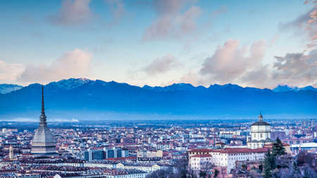 TURIN, ITALY - CIRCA AUGUST 2020: panoramic view with skyline at sunset. Wonderful Alps mountains in...
