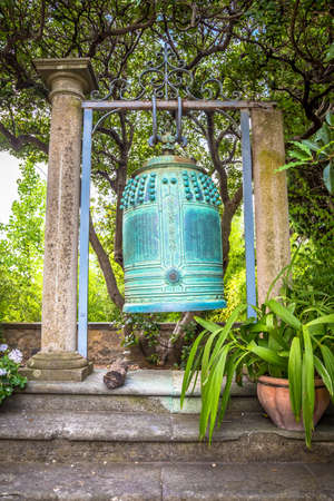 VENTIMIGLIA, ITALY - CIRCA AUGUST 2020: old Japanese bell located in Hambury Gardens and finely crafted in bronze. It seems to come from a Buddhist shrine destroyed by a fire in central Japan.のeditorial素材