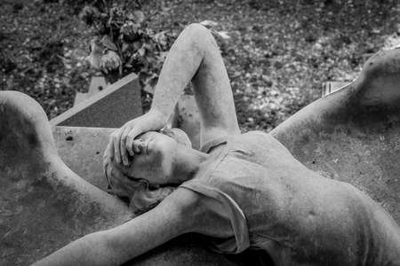GENOA, ITALY - June 2020: antique statue of angel (1910, marble) in a Christian Catholic cemetery - Italyのeditorial素材