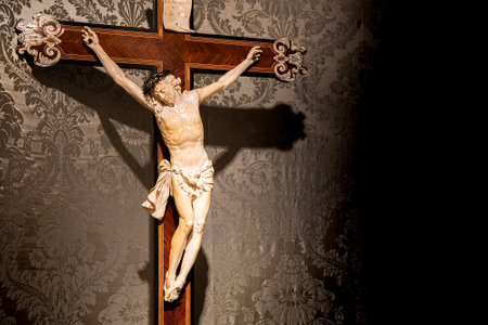 TURIN, ITALY - CIRCA MAY 2021: old crucifix made of wood and ivory (1750). Jesus Christ symbol of resurrection and life after the death.のeditorial素材