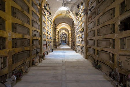 GENOA, ITALY - June 2020: corridor with statues - beginning 1800 - in a Christian Catholic cemetery...