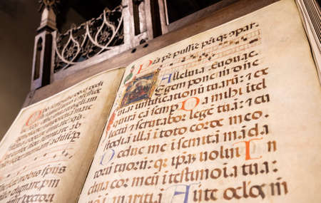 TURIN, ITALY - CIRCA MAY 2021: antique Medieval manuscript with ancient calligraphy.